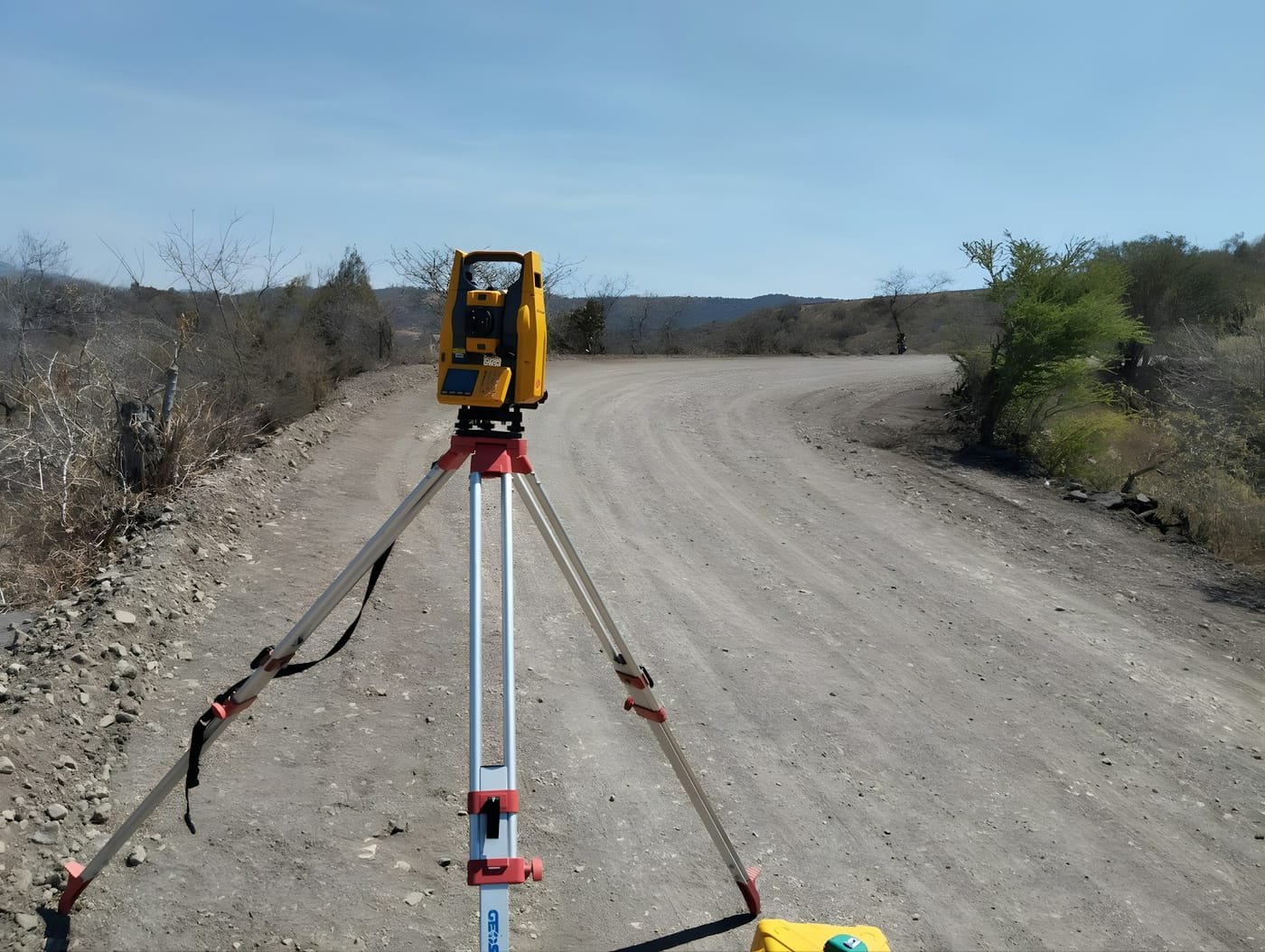 Total station set up on a graded access road